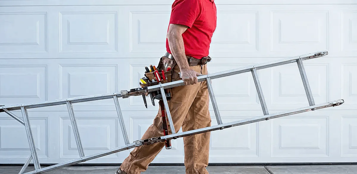 Garage door repair technician arriving with tools and ladder in Austin, TX